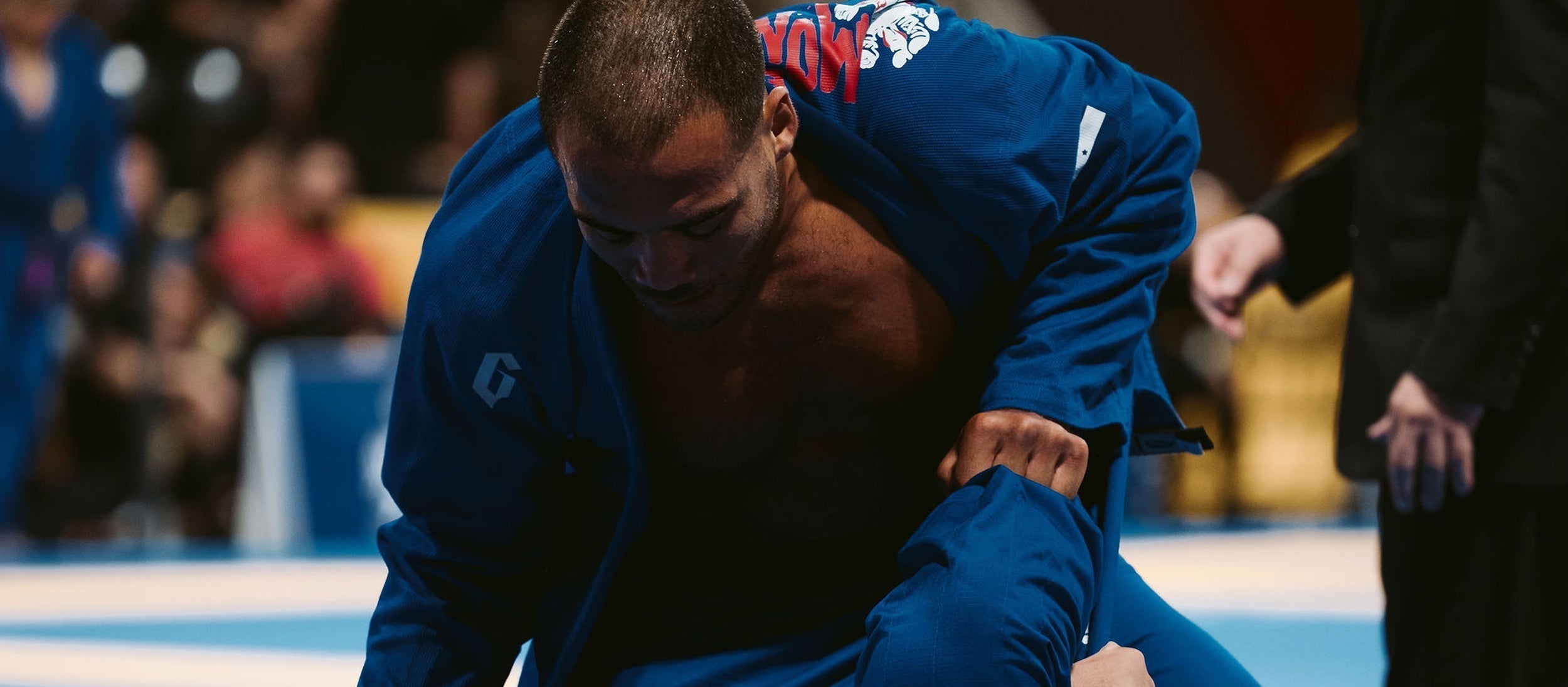 Jiu Jitsu Athlete Elder Cruz in a Customized Gameness Blue Gi in a grappling match