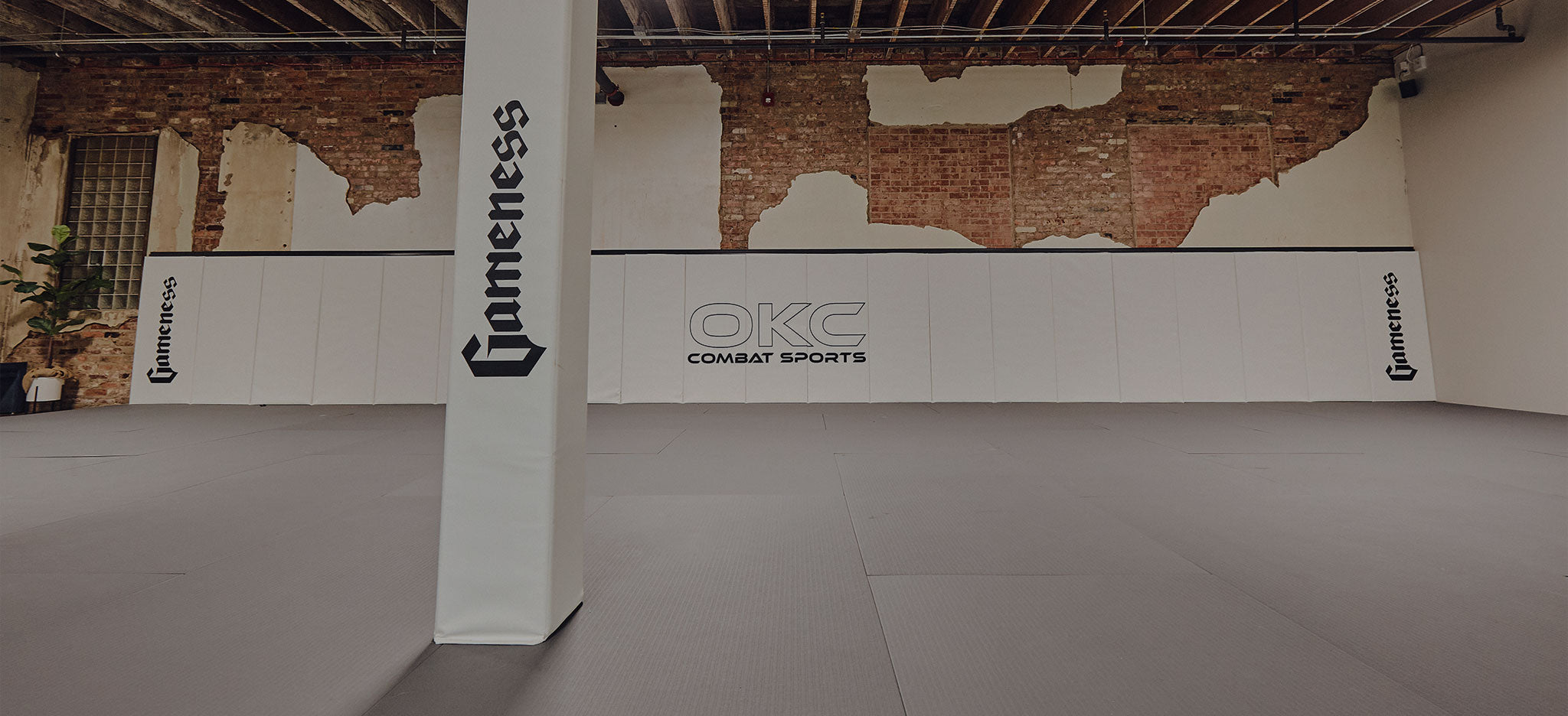 gameness mats okc combat sports matts on wall, post and floor