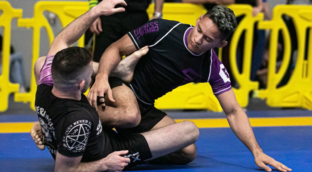 martial artists on mat wearing Gameness BJJ rashguards